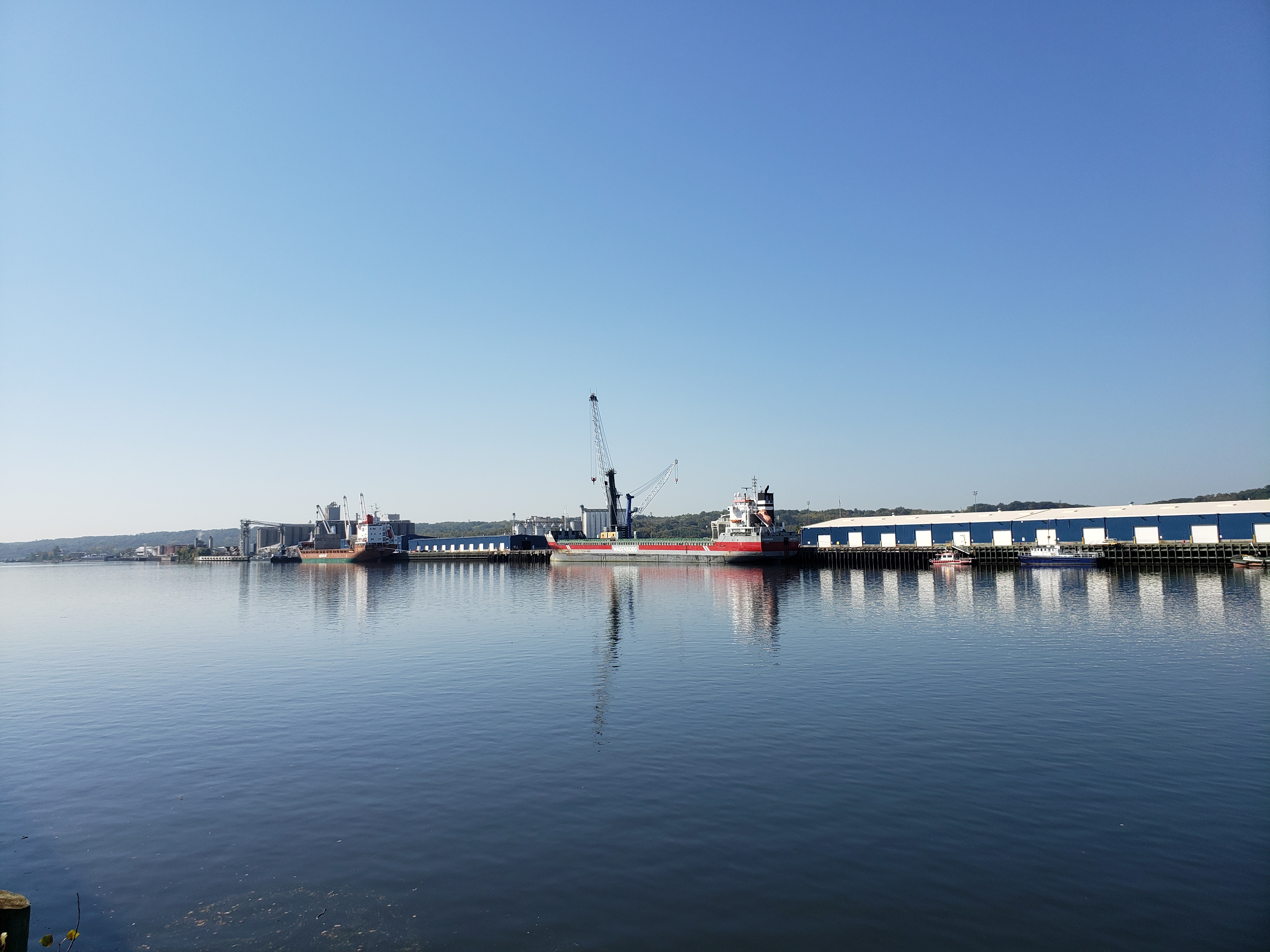 Wide view of the Port shoreline, the river and the sky casting nice blue gradients over the screen.