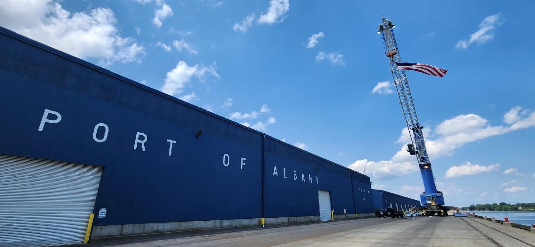 Port of Albany Shed and flag hanging from crane