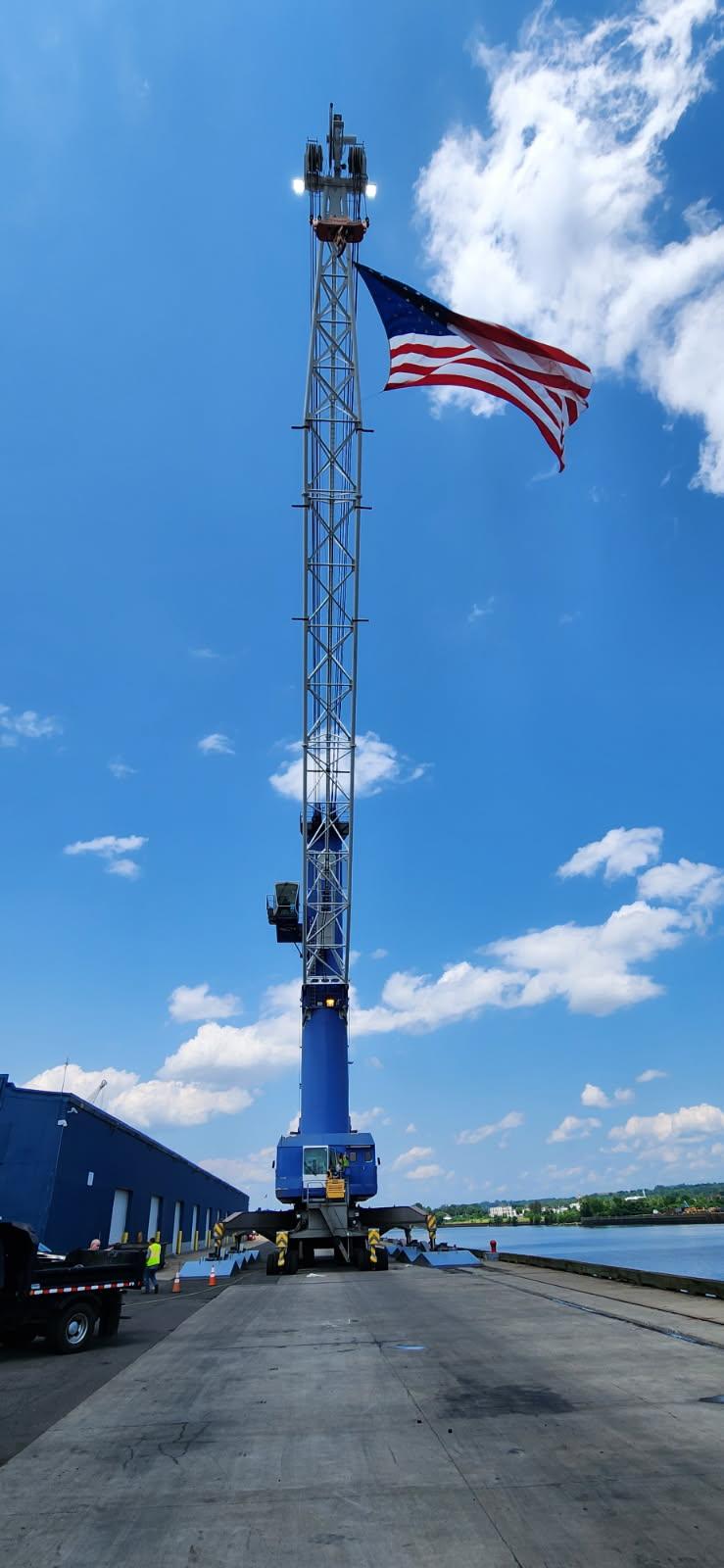 Flag hanging from crane at Port of Albany