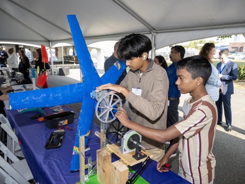 KidWind team The Two Dominators adjust their turbine at Port Industry Day 2024