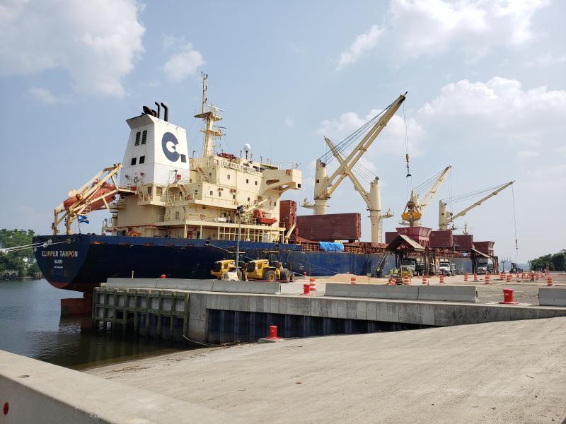 RO/RO with ship delivery grain with hoppers in the background