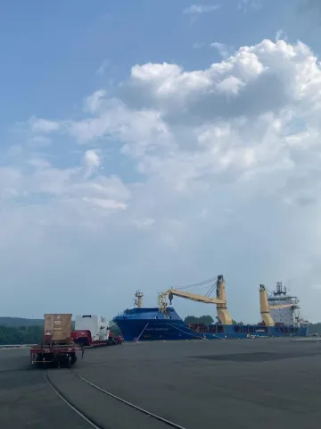 Ship, BBC Rostoy, at dock with rail cars in the foreground 
