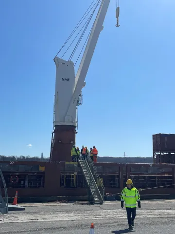 workers on ship near gangway