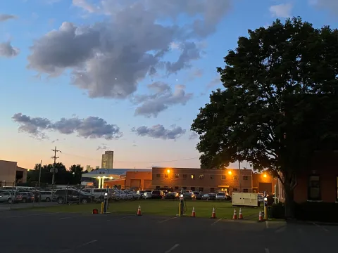 sunset with EV chargers at Port Administration building