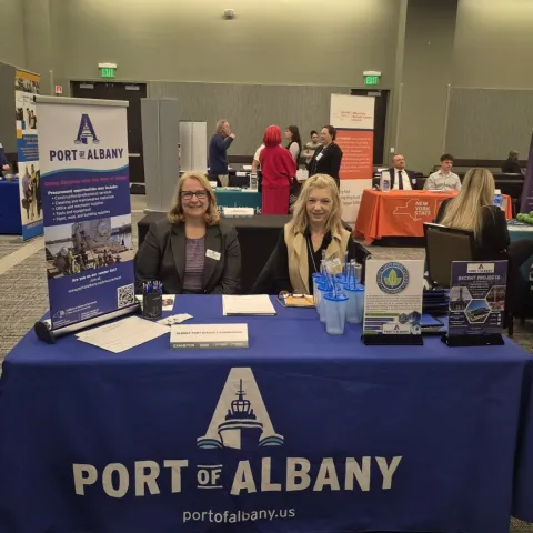 Port staffers at information table at WMBE Forum event
