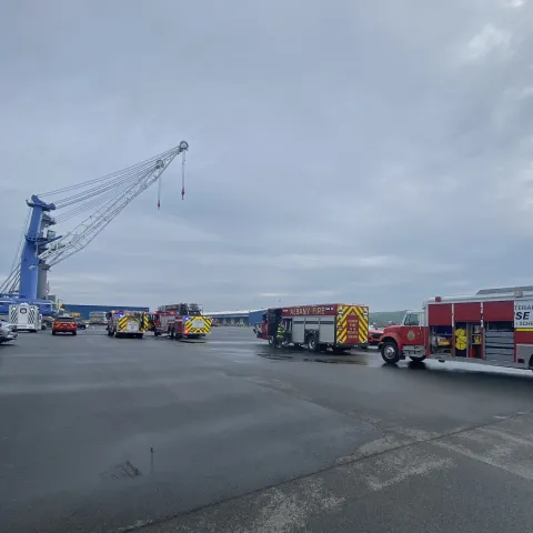 Albany fire trucks head to north end of the Port with crane in the background
