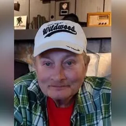 In memory of Larry Storm - casual photo of a gentleman wearing a baseball hat, red shirt, and flannel