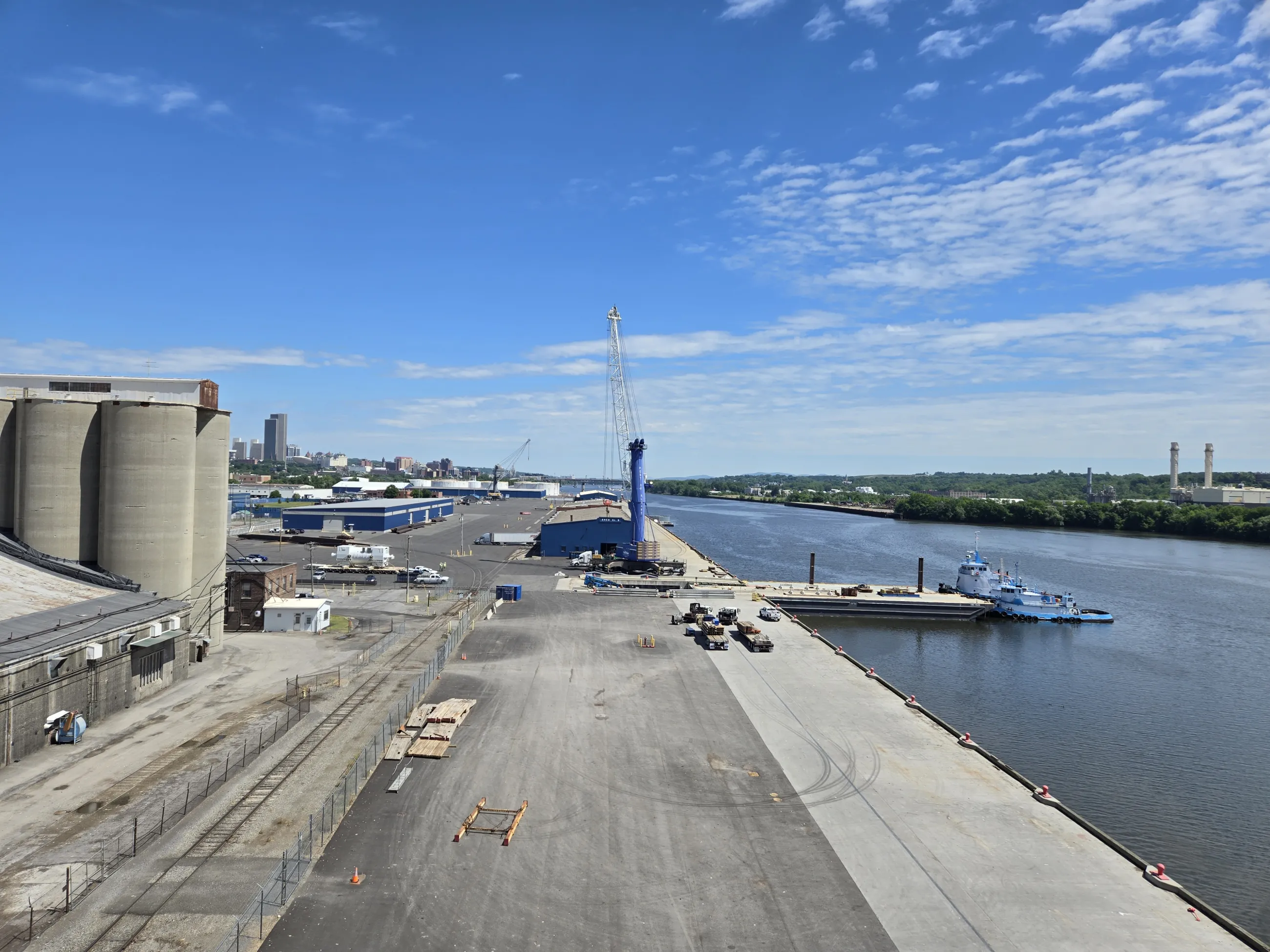 An aerial view of the Port, with the Hudson River on the right of the image and the Port facility on the left.
