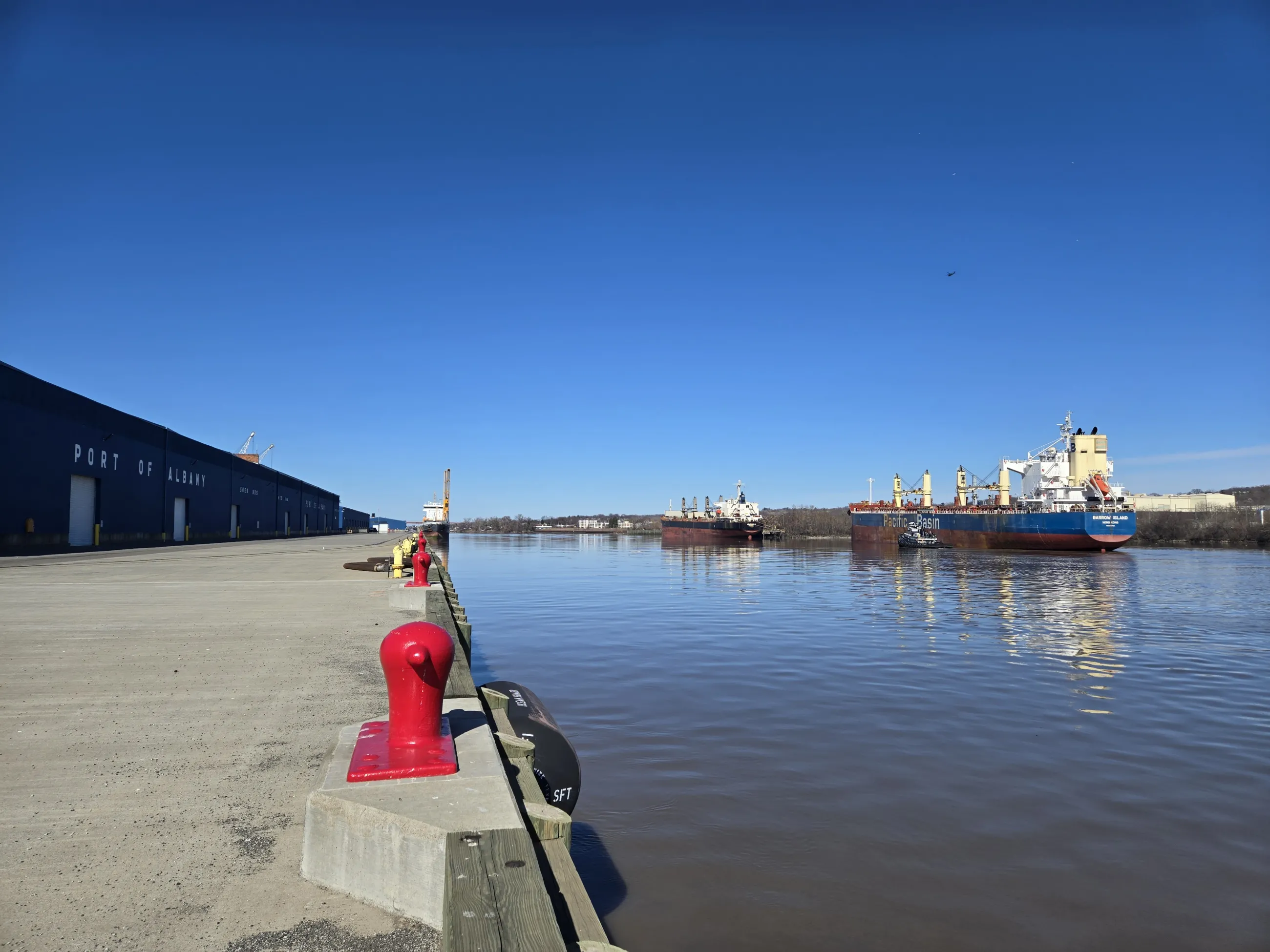 hudson river with a boat and a shed on the dock