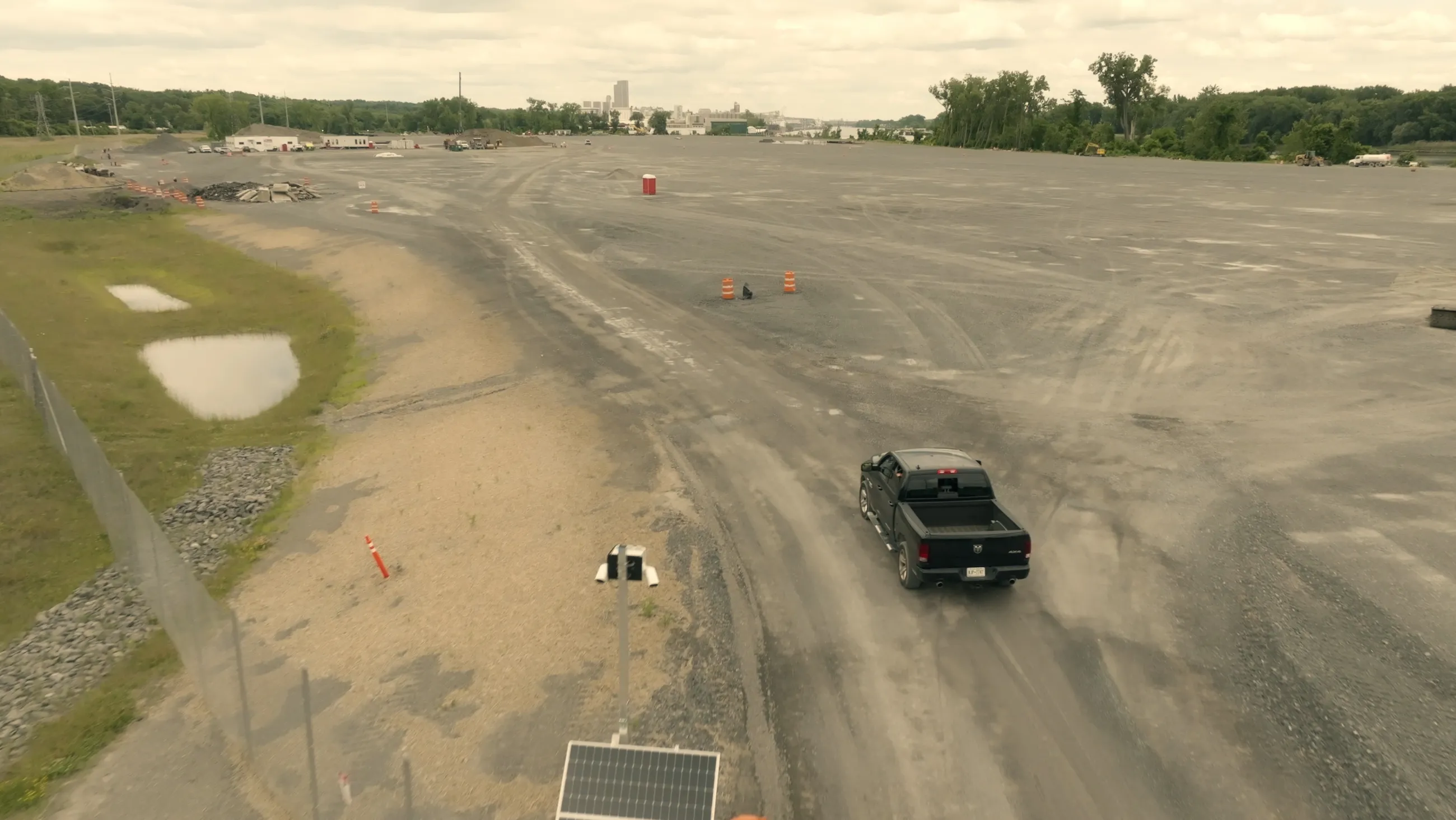 Port of Albany expansion site with truck on gravel and orange cones