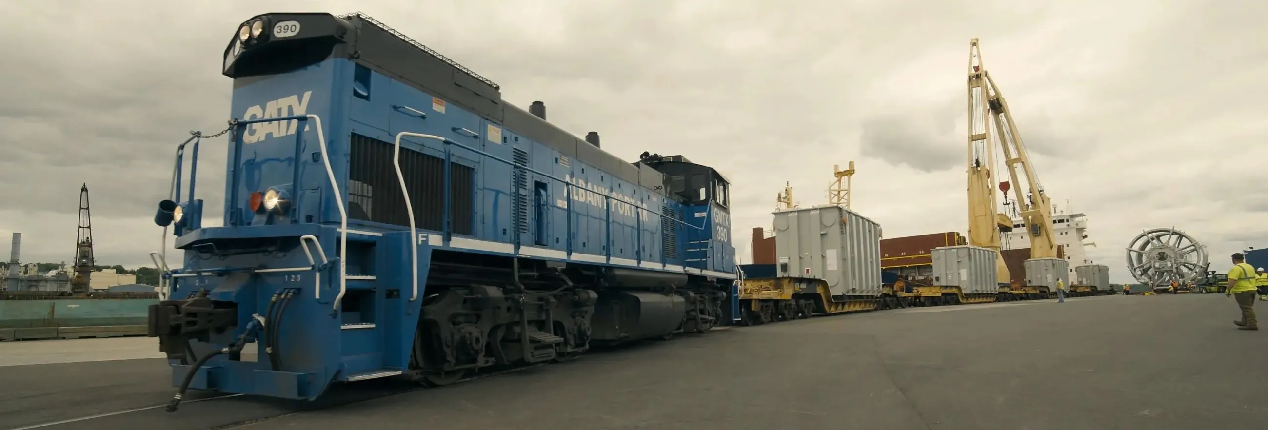 Port RR engine in foreground with ship and cranes unloaded CHP cable in background