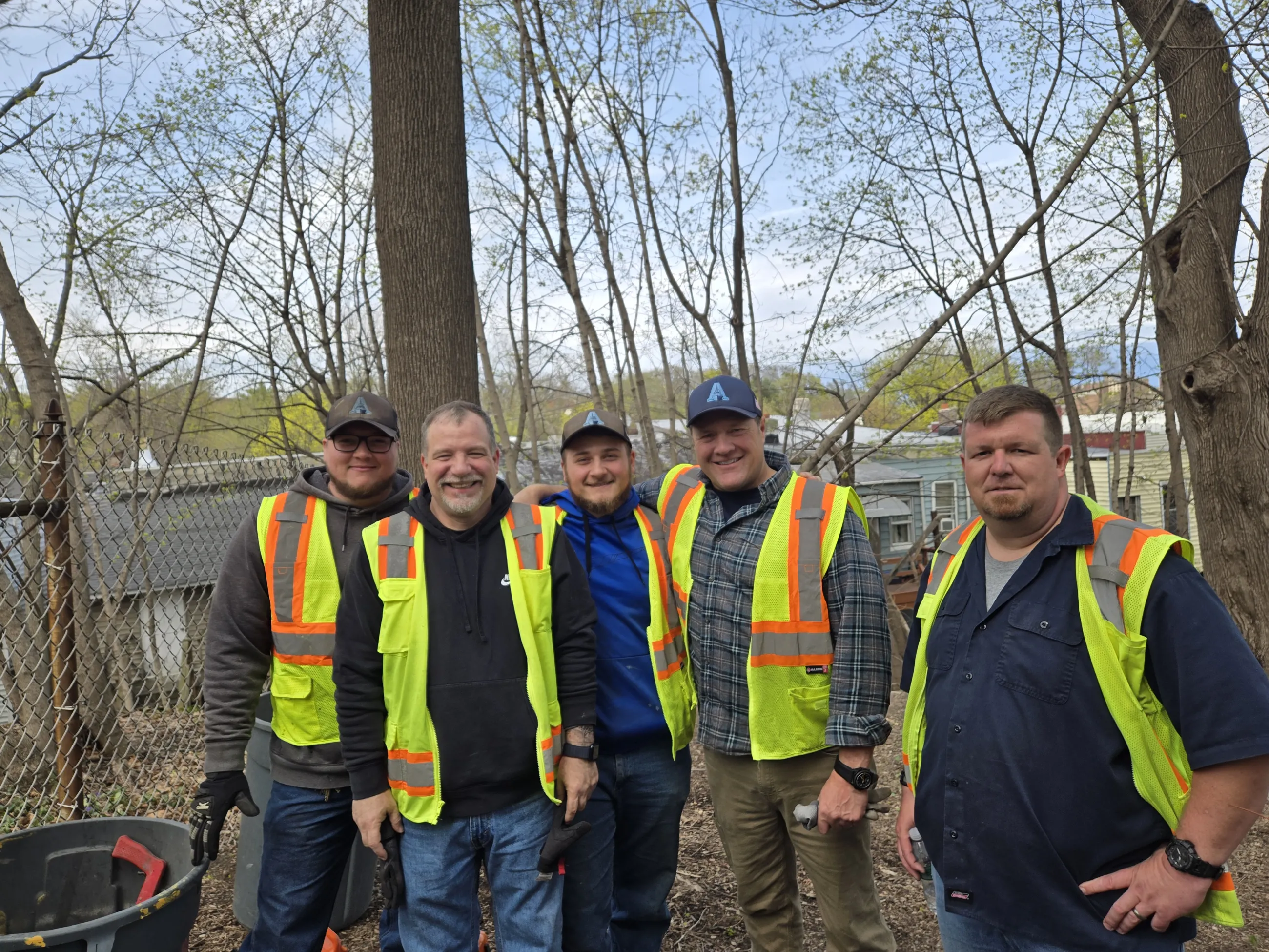 Some of the Facilities & Operations team members in safety yellow