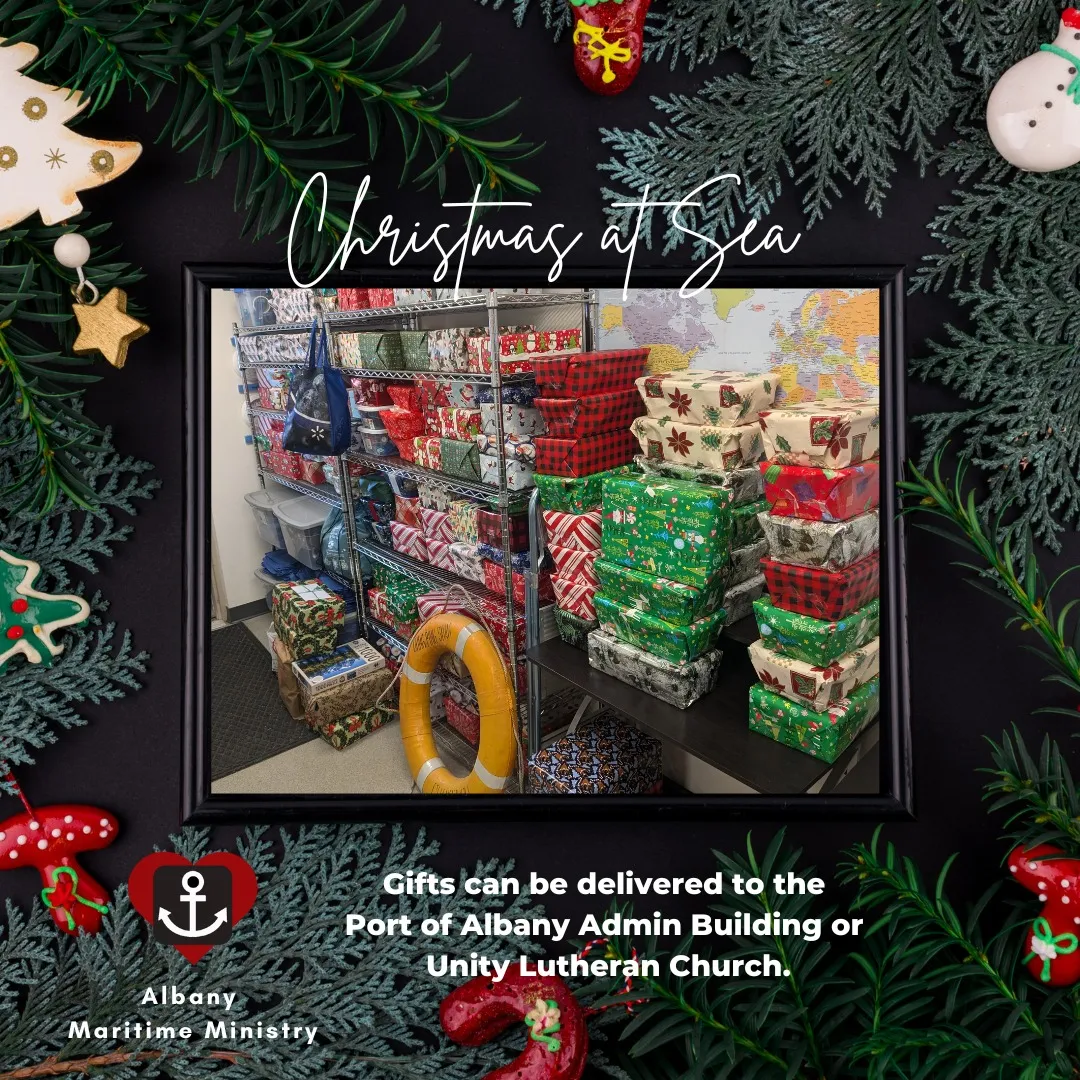 stacks of wrapped boxes on a background of a decorated Christmas tree with AMM logo and delivery instructions 
